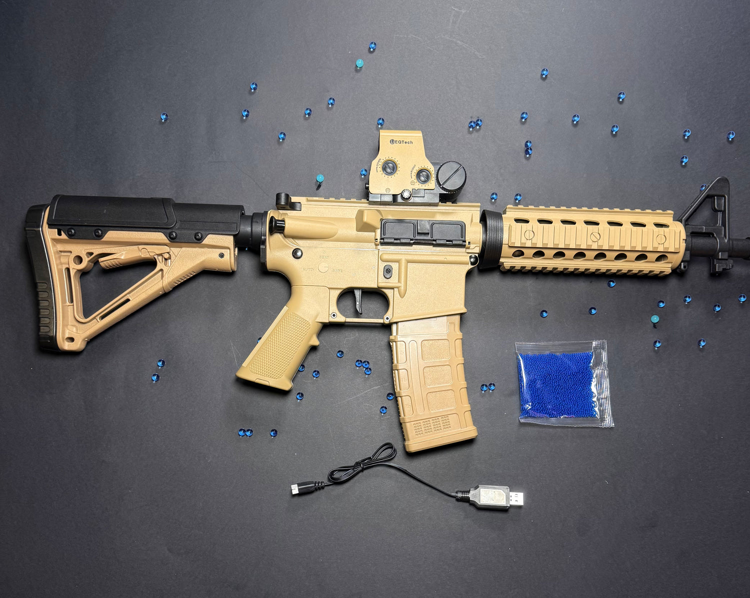 Tan rifle with accessories on a dark surface