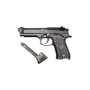 Left side of the Beretta M92F gel blaster with its clear gel ball magazine lying beside it